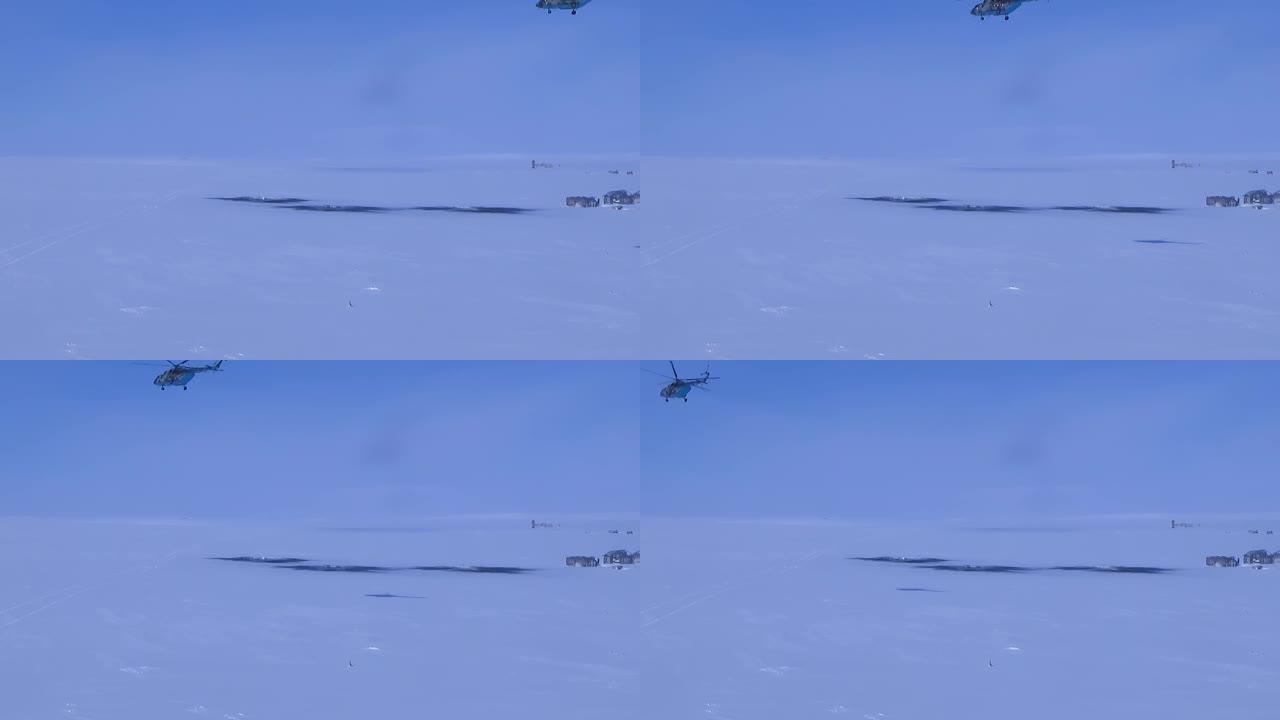 直升机飞过雪地