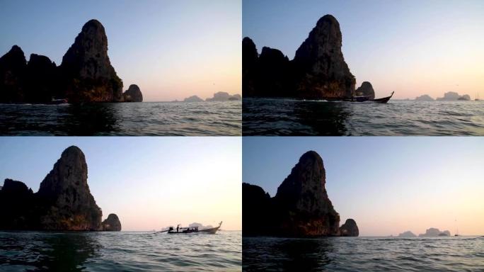 泰国南部Railay海滩日落时的长船