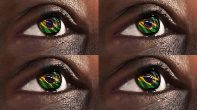 女人的黑眼睛在近距离与巴西国旗在虹膜与风的运动。视频的概念