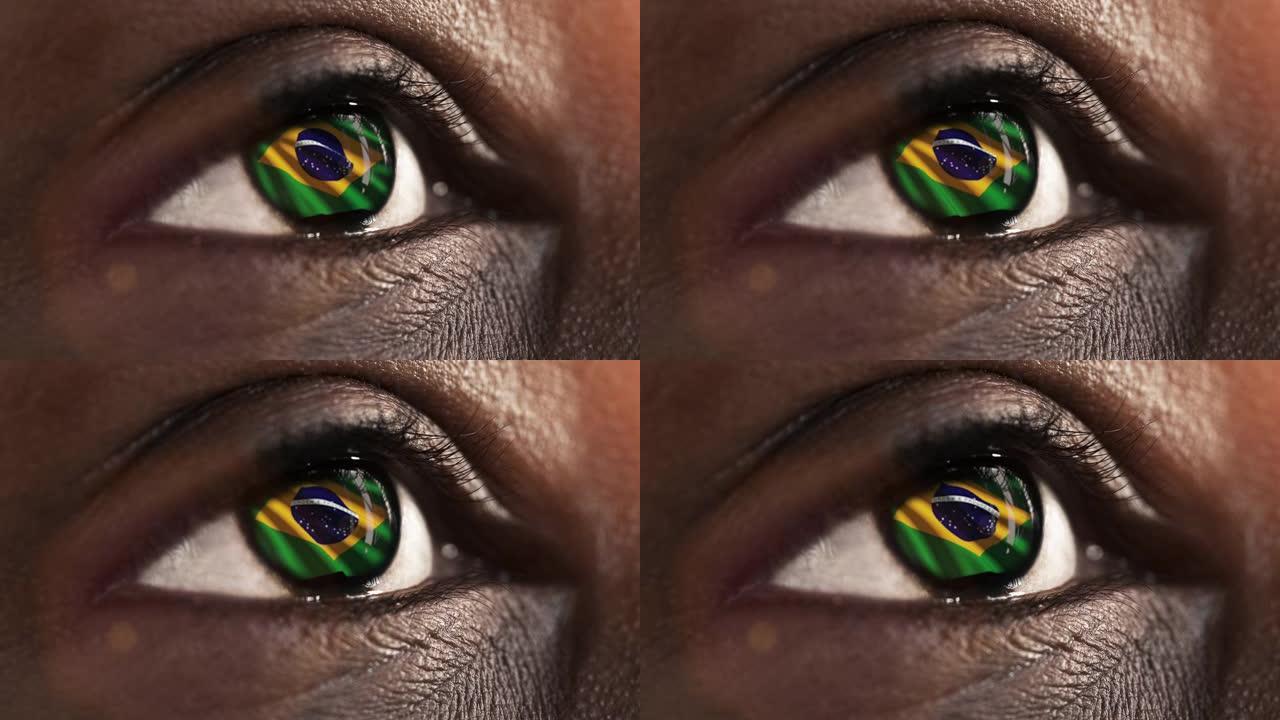 女人的黑眼睛在近距离与巴西国旗在虹膜与风的运动。视频的概念