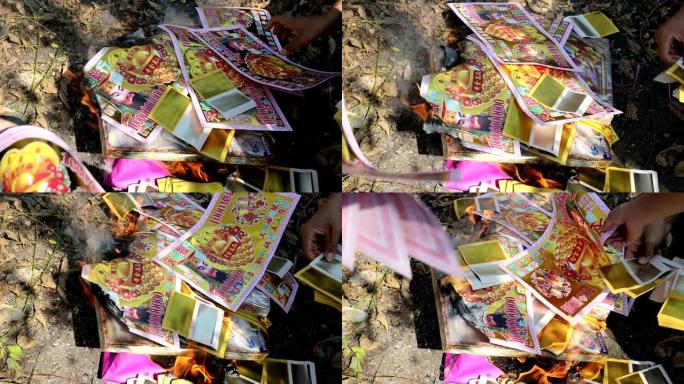 在中国清明节或清明节期间，在静宫公墓焚烧纸质材料制成的假钱。