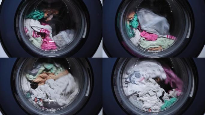 衣物在自动洗衣机中洗涤，在滚筒中旋转。洗衣服。家庭作业
