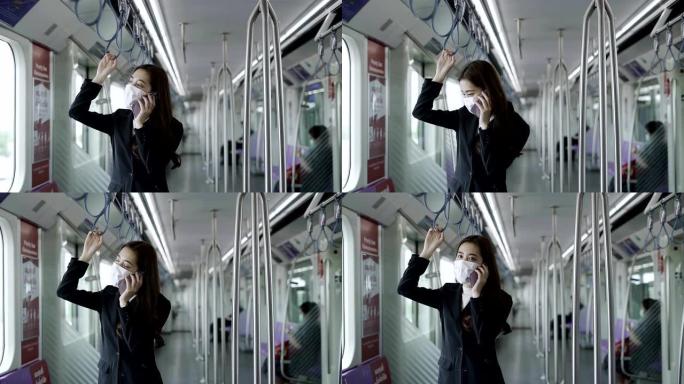在新型冠状病毒新型冠状病毒肺炎肺炎爆发期间，一名戴着黑色外科口罩的年轻亚洲妇女在地铁列车上的特写