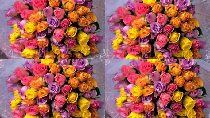 花店白纸上美丽的五颜六色玫瑰花束，特写镜头。