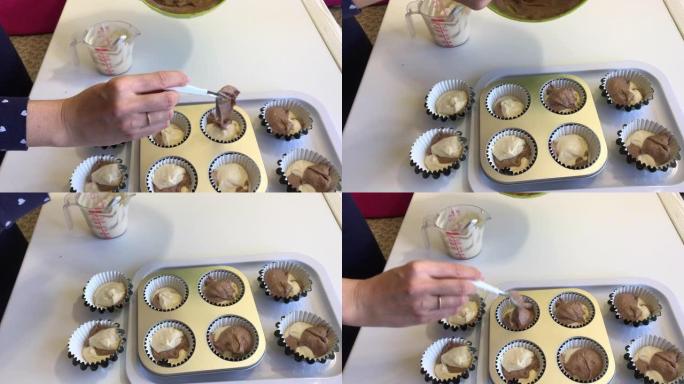 一个女人把有可可豆和没有可可豆的面团放在松饼烤盘里。制作大理石蛋糕