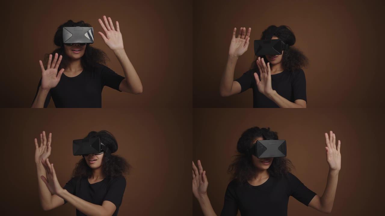 非裔美国女孩戴虚拟现实护目镜看电影玩电子游戏