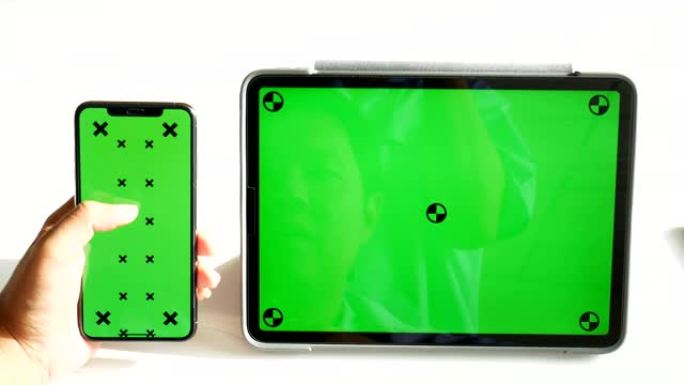 使用带有绿色屏幕的手机和数字平板电脑