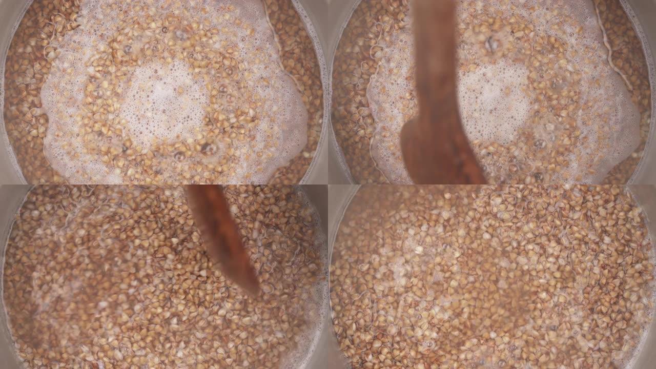 在锅中煮沸的荞麦种子的俯视图。烹饪食物概念