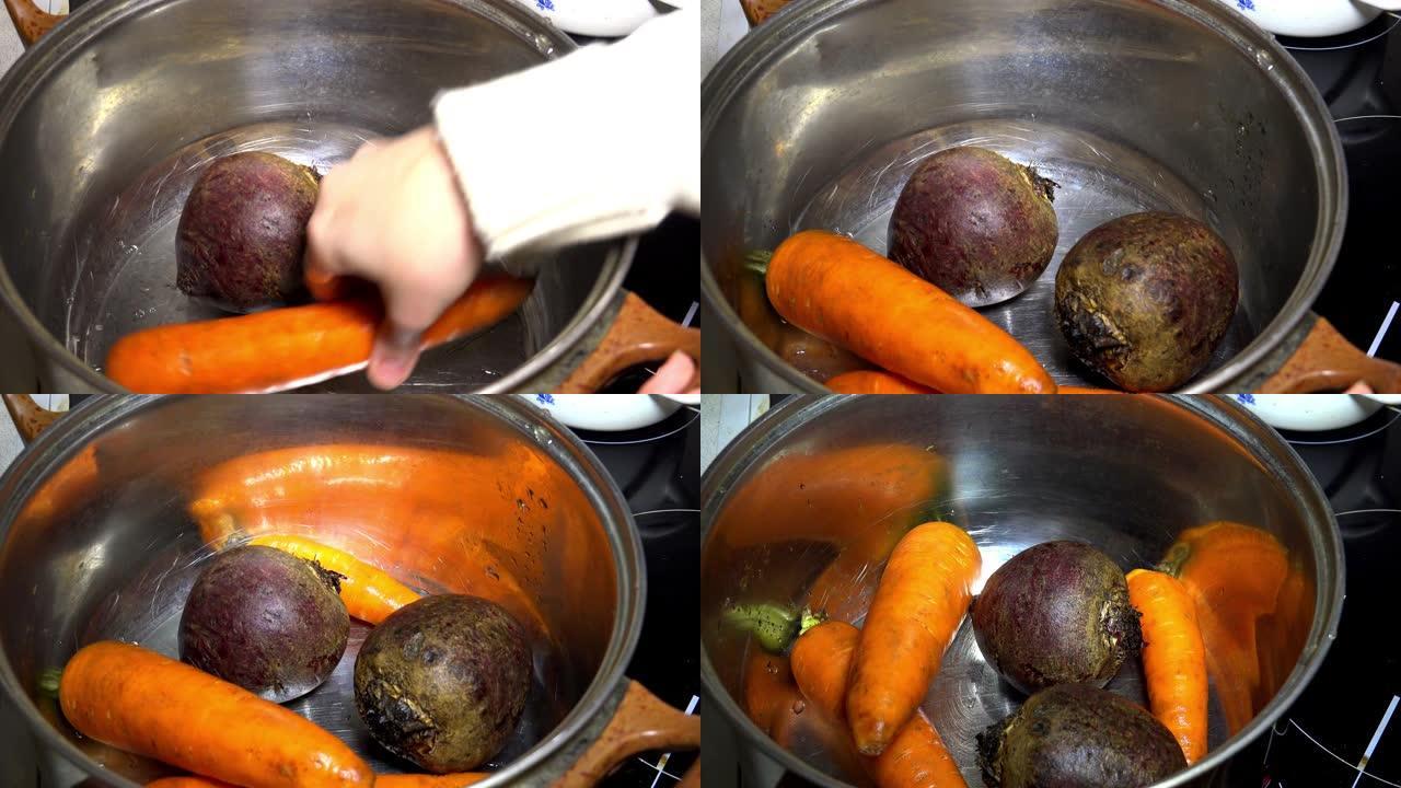 锅里的蔬菜。甜菜和胡萝卜。4K。