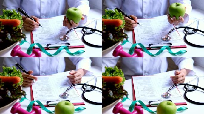营养师与健康的水果，蔬菜和卷尺工作，正确的营养和饮食概念