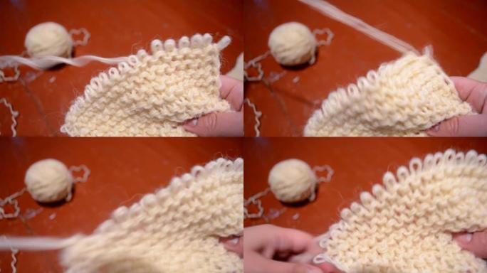 解开用羊毛线编织的织物