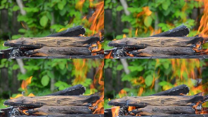 烧柴。火焰在烤架上燃烧。火灾特写。