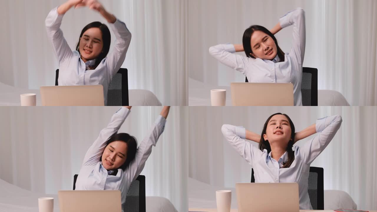 亚洲商界女性在家工作后舒展身体放松的行动