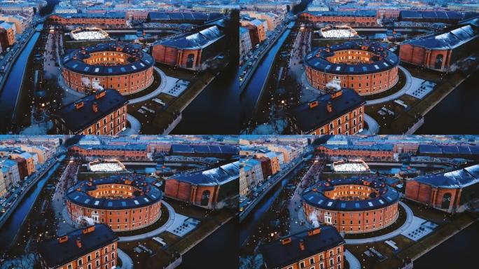 俄罗斯圣彼得堡的新荷兰岛。圆形的古代欧洲砖砌建筑的鸟瞰图。城市景观4k飞行。全景几何结构
