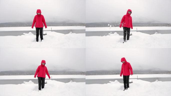 女人在朱砂湖玩雪雪地雪花