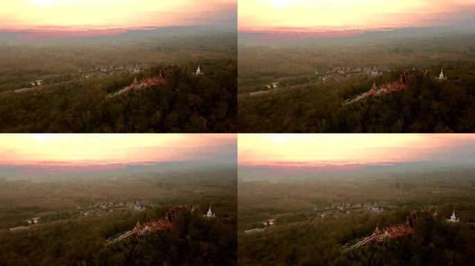 黎明时分，泰国南邦省乡村小山丘上的多帕禅寺 (Wat Phra) 的鸟瞰图。