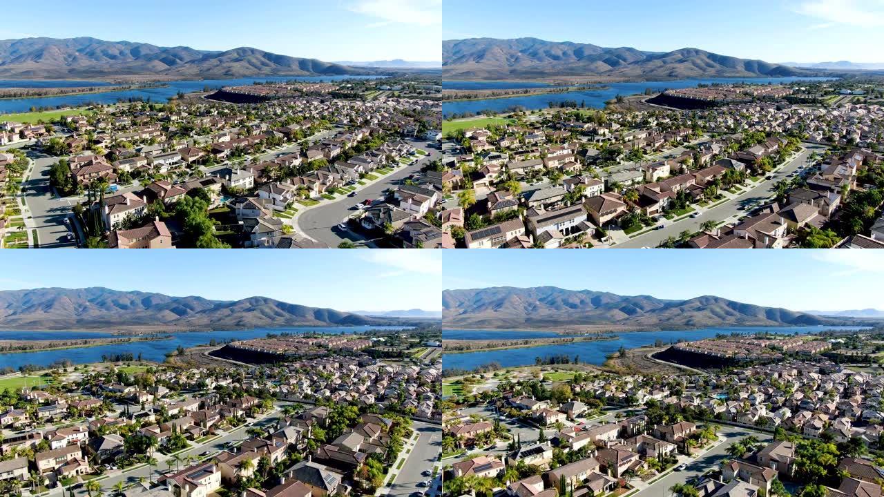 加州背景上有大湖和山的相同住宅公寓的鸟瞰图