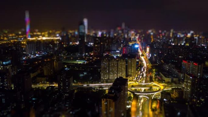 夜间照明广州城市景观交通路口空中倾斜移动全景4k延时中国