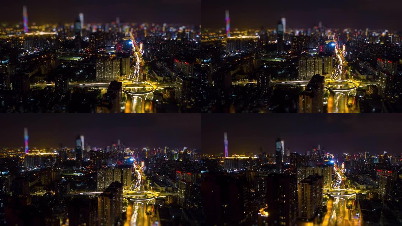夜间照明广州城市景观交通路口空中倾斜移动全景4k延时中国