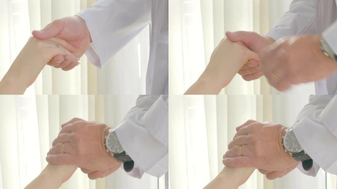 医生给予鼓励支持和牵着女人病人慢动作的手