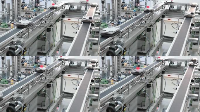 智能工厂的自动汽车正在生产线上从装货站到卸货站