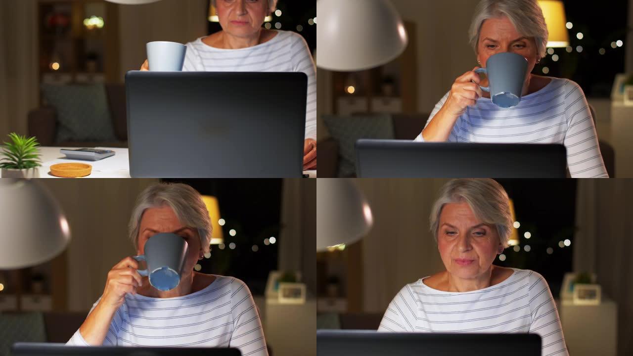 带笔记本电脑的高级女性在家喝咖啡