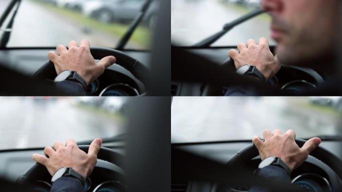 雨天手持方向盘在道路上行驶