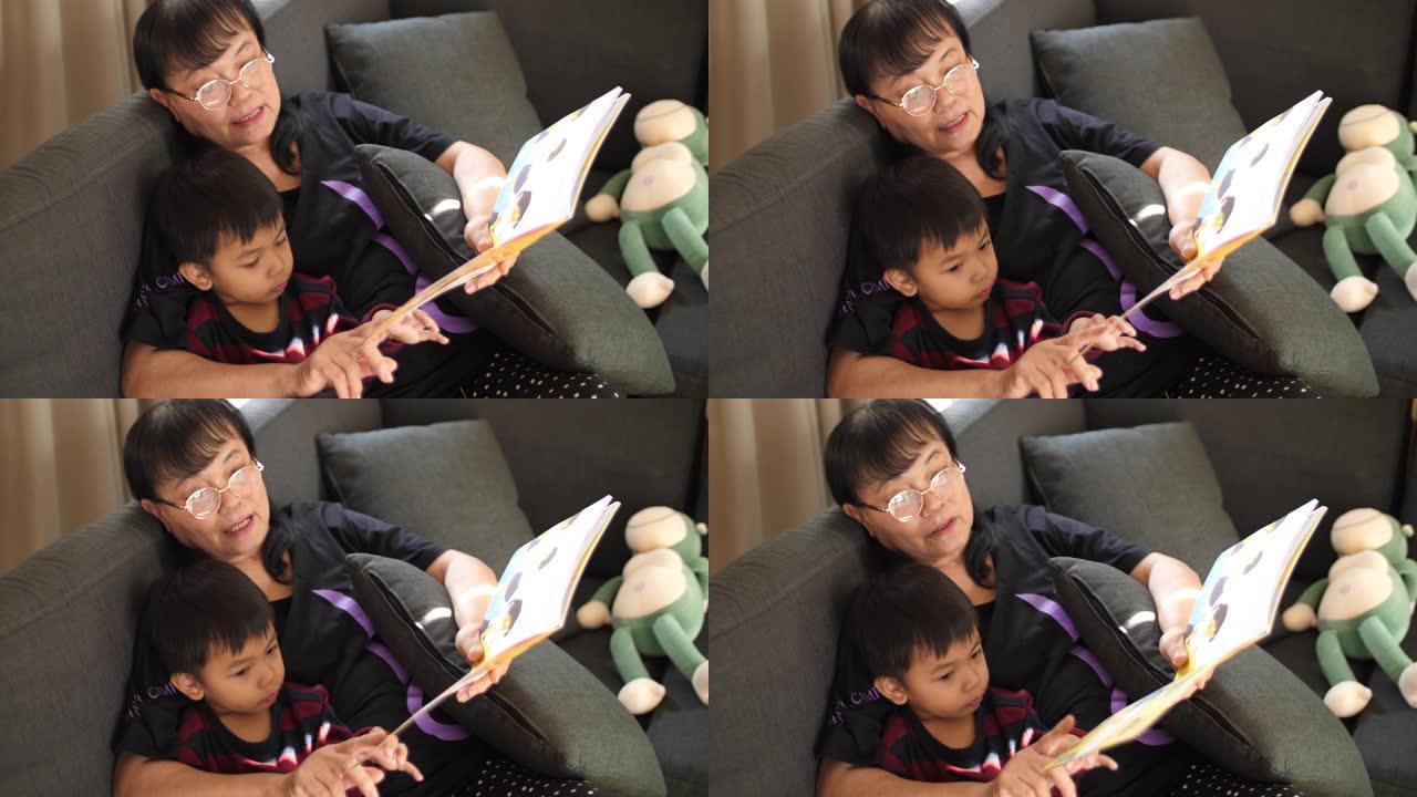 SLO MO，祖母和男婴正在阅读儿童读物