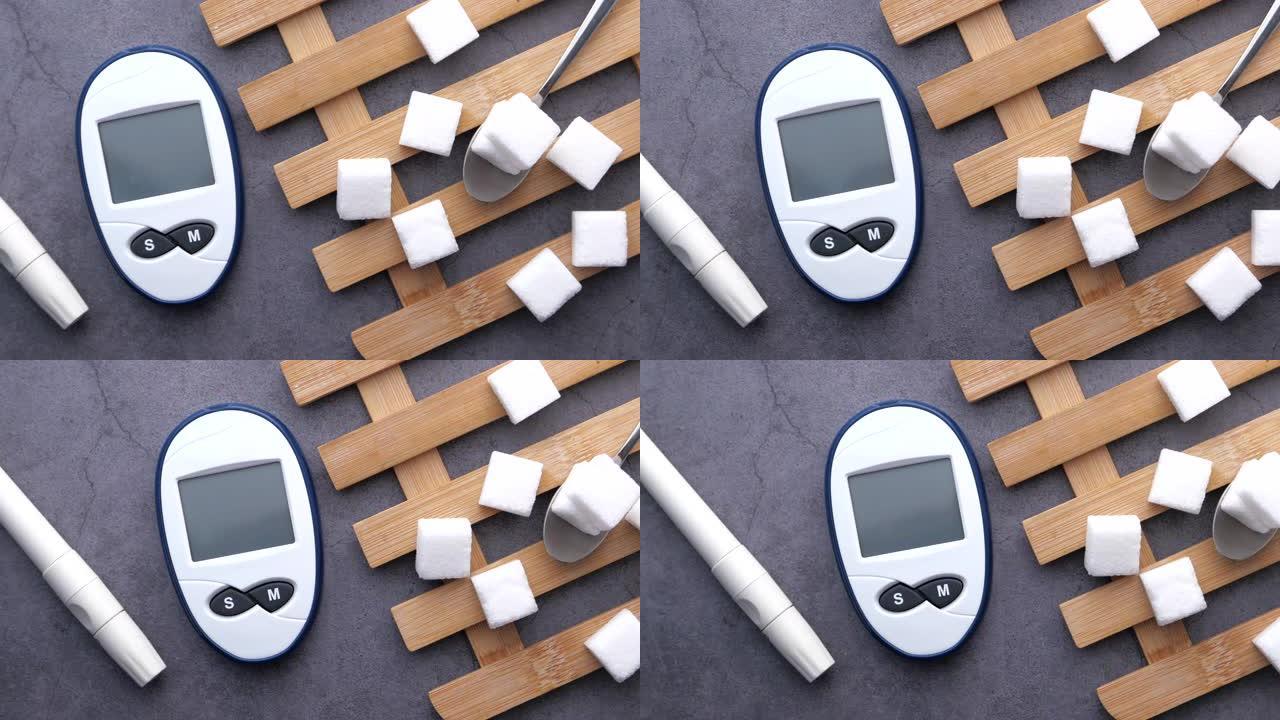 糖尿病测量工具和桌子上的方糖