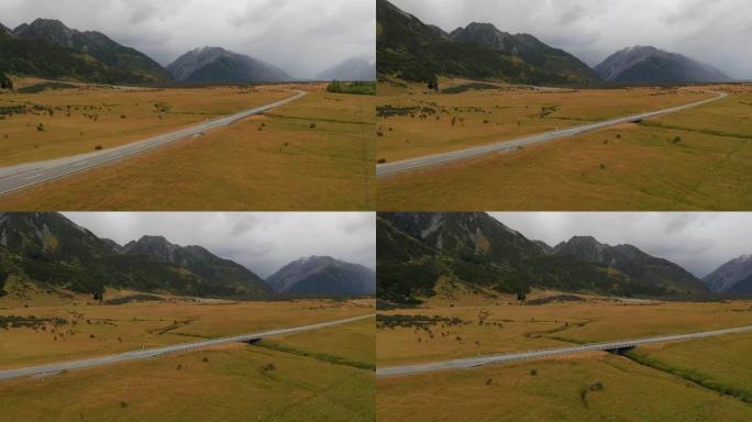 令人惊叹的风景多风的道路，有山和冰川湖，鸟瞰图。新西兰80号库克山国道。