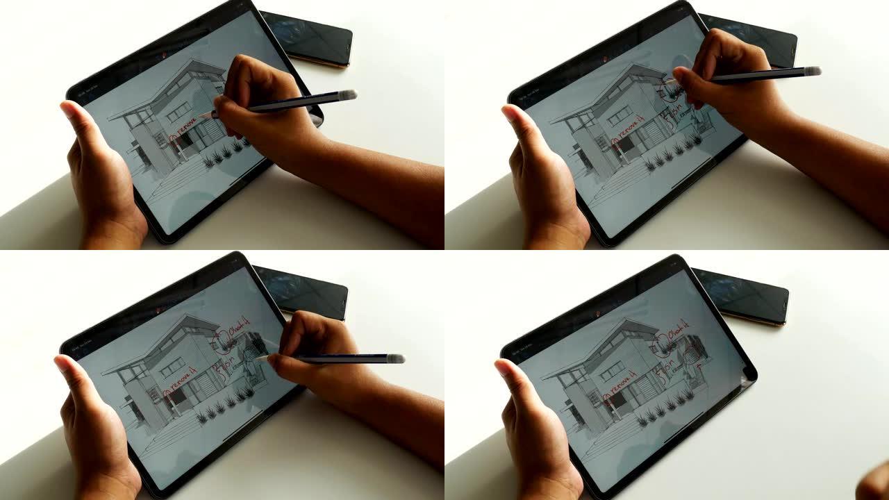 建筑师在数字平板电脑的平面图上绘制油漆
