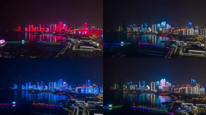 夜间照明显示青岛市市中心奥林匹克湾空中延时全景4k中国