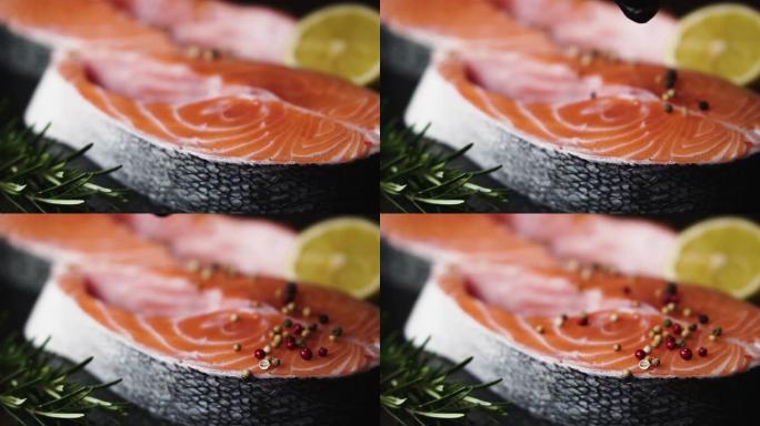 厨师用胡椒混合调味鲑鱼排，慢动作。健康食品的概念。