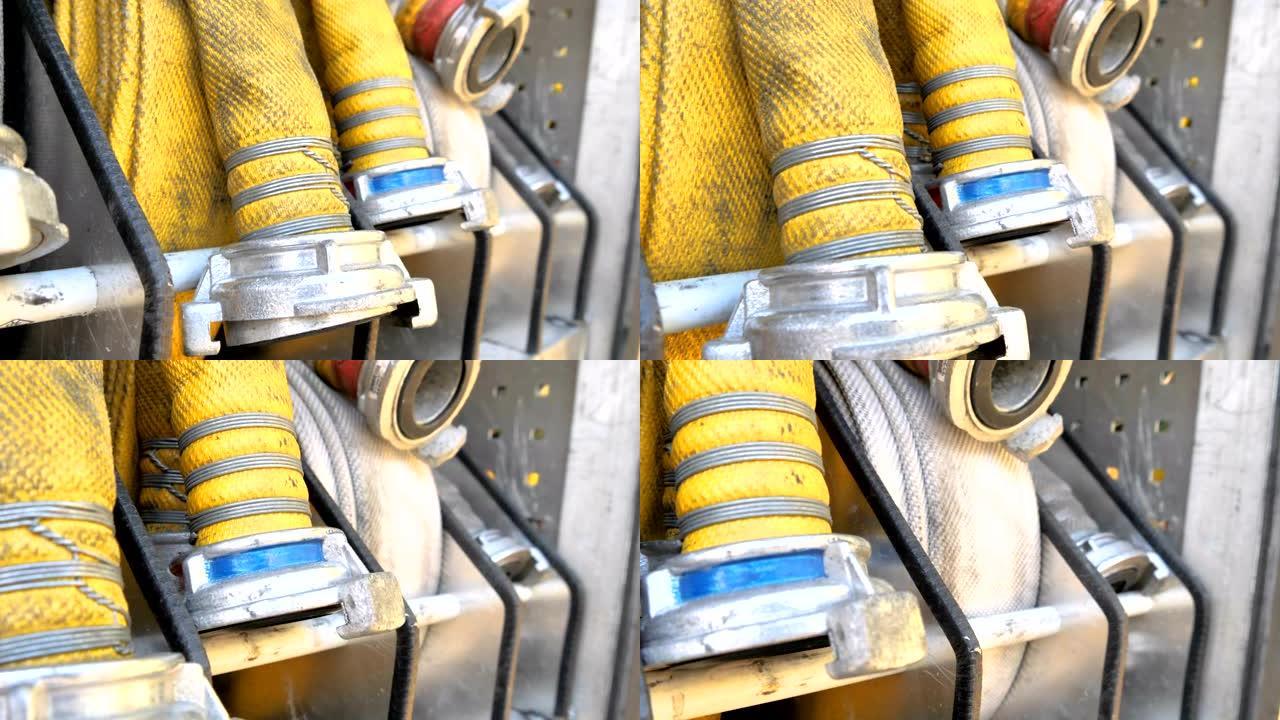 黄色的消防软管和金属阀门