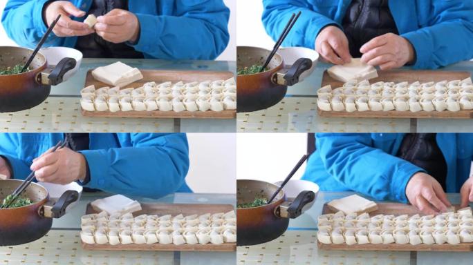看到身份不明的人的手做美味的自制饺子，里面塞满了肉末和蔬菜。传统中餐，4k镜头，快速动作镜头。