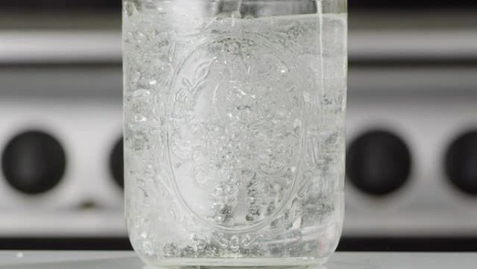 Pinging Sparkling Water Into a Glass