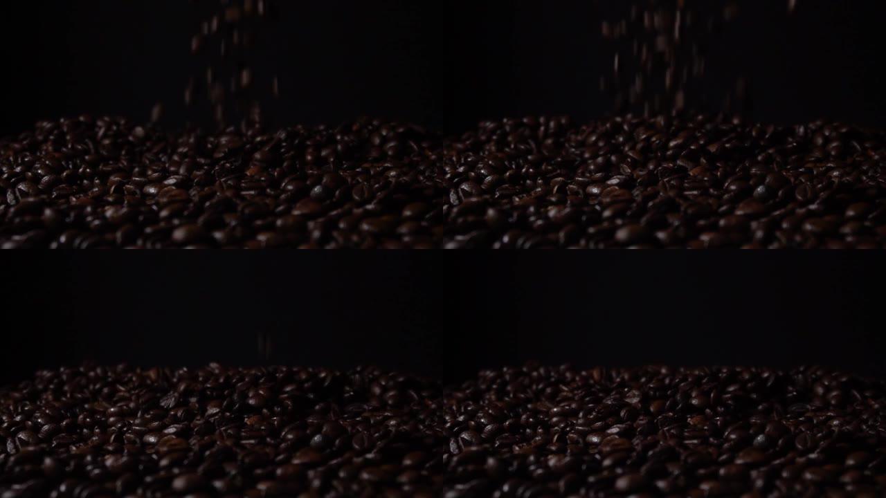 新鲜烘焙咖啡豆在黑色背景前慢动作落下