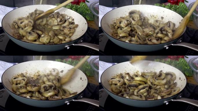 在煎锅特写镜头中搅拌蘑菇