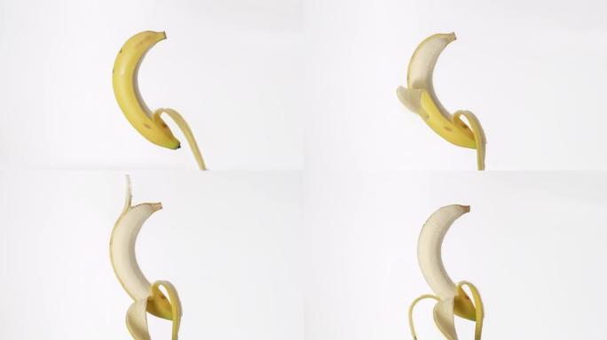 新鲜香蕉在没有人的情况下在白色背景上剥皮