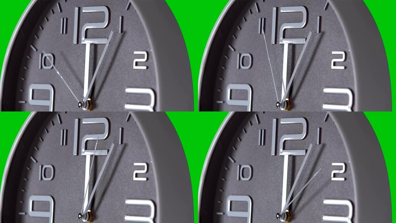 绿色背景上的挂钟特写指针秒针转动灰色钟表