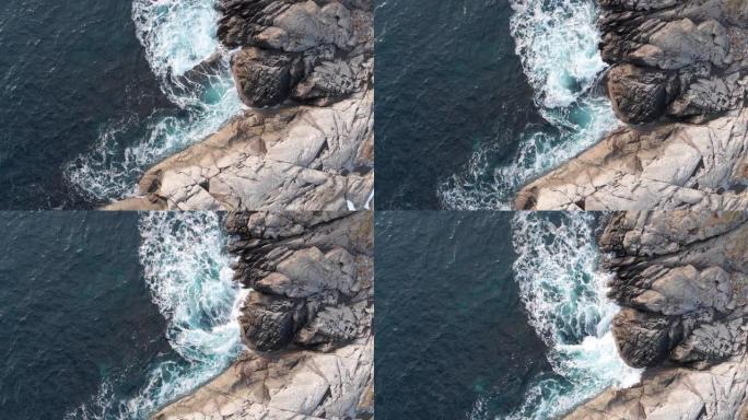 海浪撞击海边的岩石