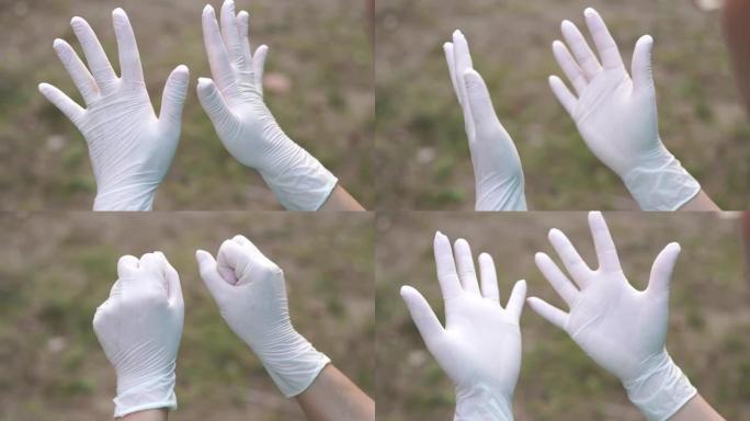 女人在清洁新型冠状病毒肺炎病毒前戴上防护手套