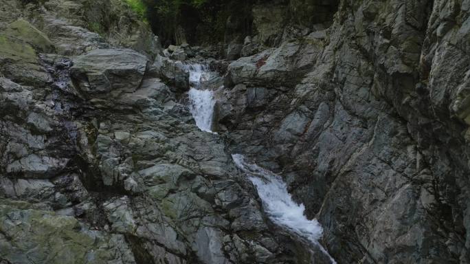航拍大山岩石瀑布溪流森林自然风光