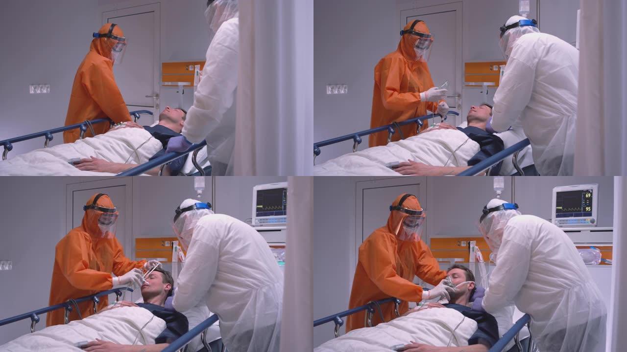 身穿防护服的医生为患有冠状病毒慢动作多莉射击的患者戴上氧气面罩