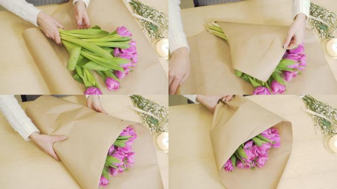 花店的女性手在商店里用纸装饰一束郁金香。人员、业务、销售和花艺概念