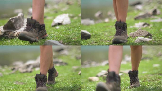 徒步旅行者女孩穿着靴子在大自然中