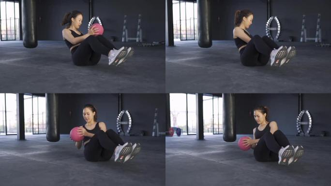 女人在健身馆用普拉提蹲腿锻炼健康的生活方式肌肉建设者，运动运动女人训练耐力强锻炼。高清慢动作镜头电影