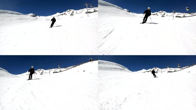 一个穿着黑色装备和白色头盔戴着滑雪杆的广角男滑雪者在阳光明媚的日子里在雪坡上骑行。冬季滑雪运动的概念