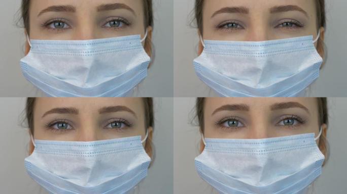 戴着保护性医用蓝色面具的女人的脸，特写。年轻女性戴着医用口罩预防和保护病毒感染。大流行保护新型冠状病
