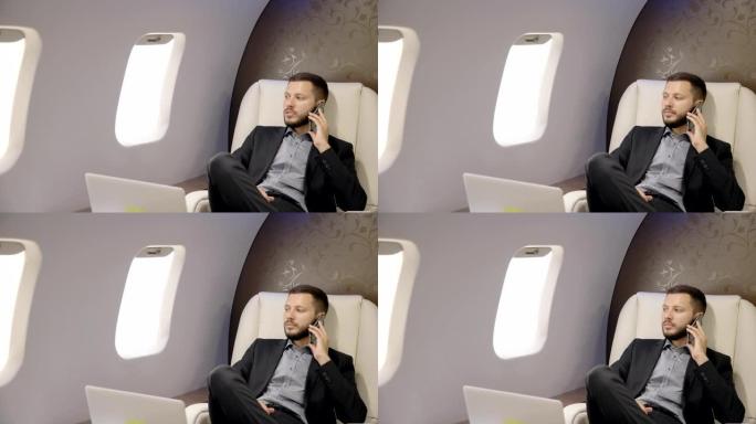 成功的企业家正在坐在飞机企业家的头等舱里打电话